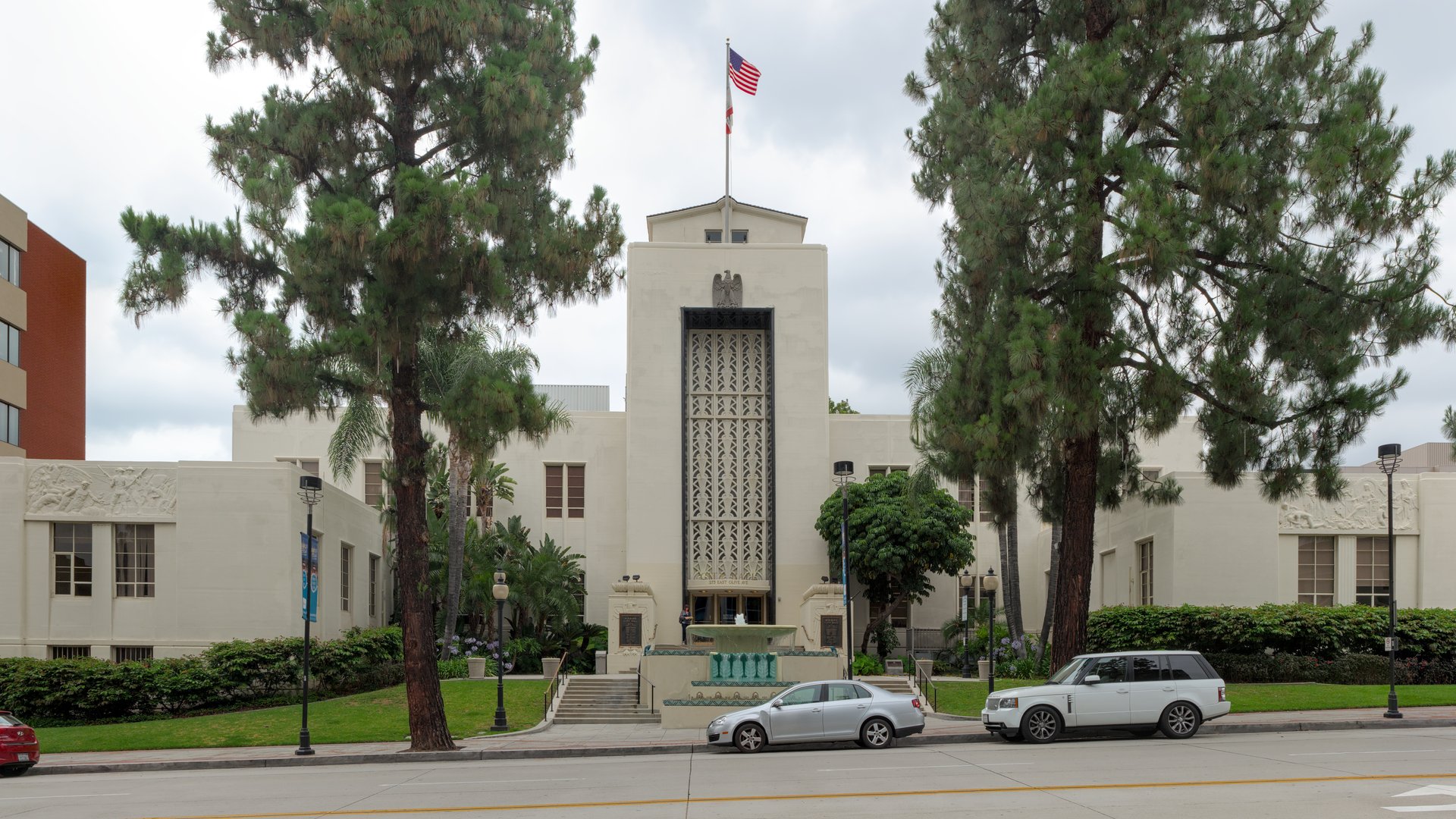Burbank City Hall with its landmark tower, flag, and tree-lined lawn